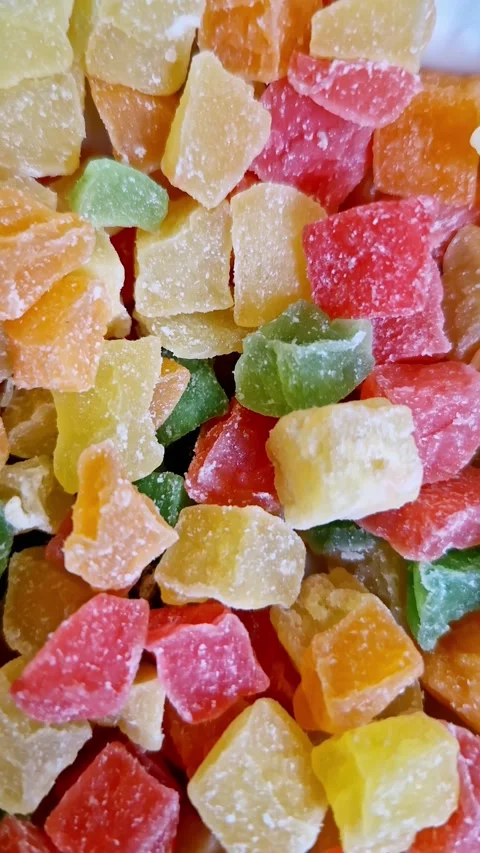 Multicolored Candied Fruit Cubes Piled Together for Sweet Snack Background Stock Footage 338999544