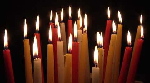 Multicolored candles burning on black background Video stock 8961022