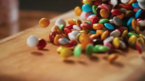Multicolored candy balls and a tree floor pass in front of the camera. Stock Footage 140509513