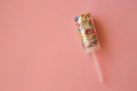 Multicolored candy in a package on a pink background. Candy is the best decor Stock Photos