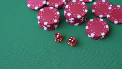 Multicolored casino chips as a conceptual backdrop for gambling games like poker Stock Footage 346773103