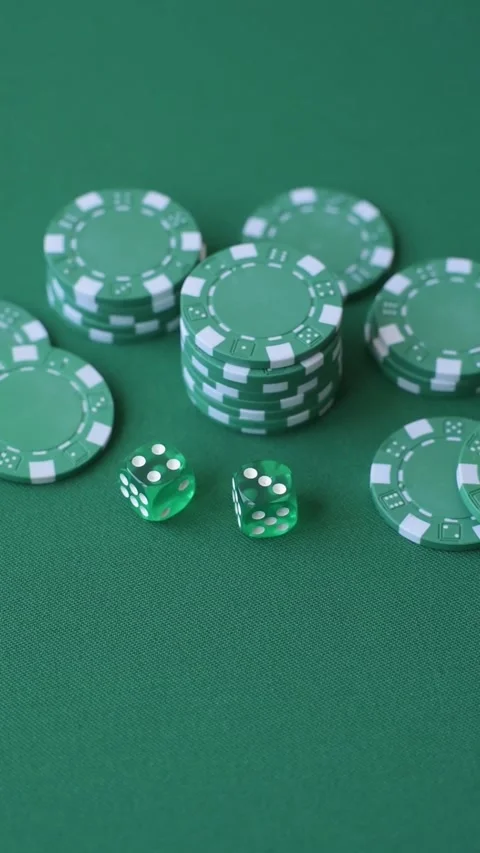 Multicolored casino chips as a conceptual backdrop for gambling games like poker Stock Footage 346773114