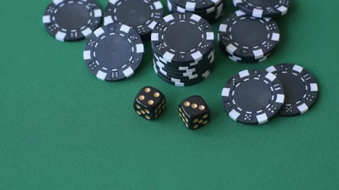 Multicolored casino chips as a conceptual backdrop for gambling games like poker Stock Footage 346773117