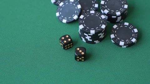 Multicolored casino chips as a conceptual backdrop for gambling games like poker Stock Footage 346773119
