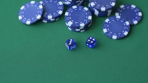 Multicolored casino chips as a conceptual backdrop for gambling games like poker Stock Footage 346773122