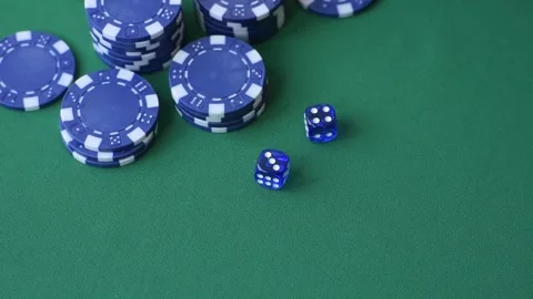 Multicolored casino chips as a conceptual backdrop for gambling games like poker Stock Footage 346773128