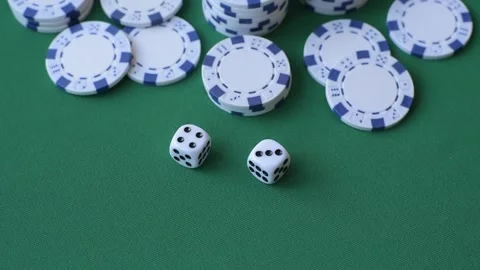 Multicolored casino chips as a conceptual backdrop for gambling games like poker Stock Footage 346773130