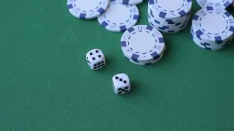 Multicolored casino chips as a conceptual backdrop for gambling games like poker Stock Footage 346773132