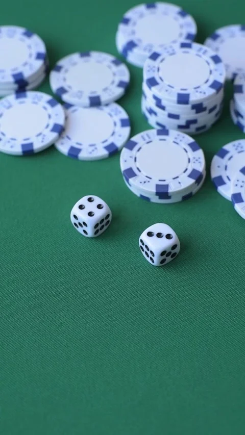 Multicolored casino chips as a conceptual backdrop for gambling games like poker Stock Footage 346773134