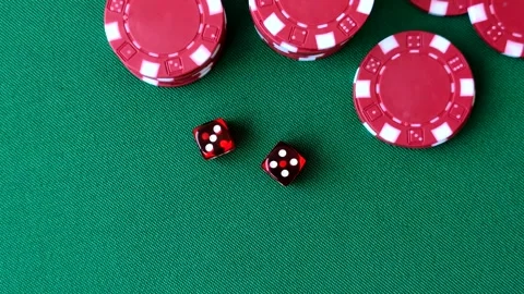Multicolored casino chips as a conceptual backdrop for gambling games like poker Stock Footage 346773145