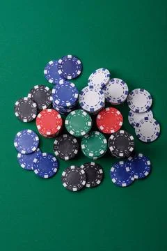 Multicolored casino chips as a conceptual backdrop for gambling games. Mult.. Stock Photos