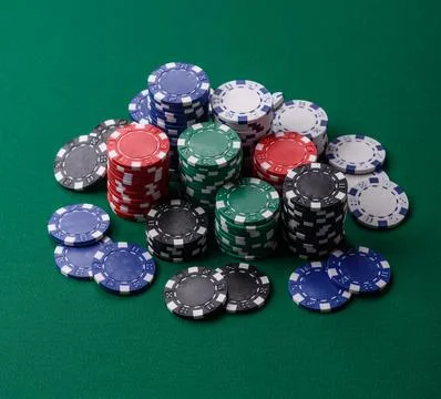 Multicolored casino chips as a conceptual backdrop for gambling games. Mult.. Stock Photos
