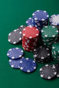 Multicolored casino chips as a conceptual backdrop for gambling games. Mult.. Stock Photos