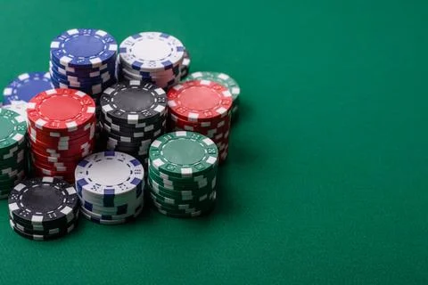 Multicolored casino chips as a conceptual backdrop for gambling games. Mult.. Stock Photos