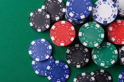 Multicolored casino chips as a conceptual backdrop for gambling games. Mult.. Stock Photos