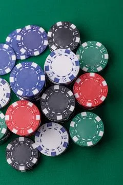 Multicolored casino chips as a conceptual backdrop for gambling games. Mult.. Stock Photos