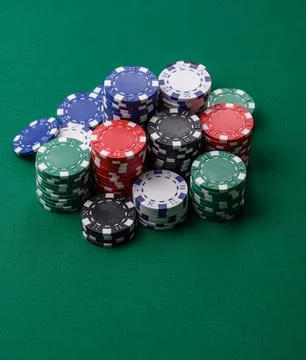 Multicolored casino chips as a conceptual backdrop for gambling games. Mult.. Stock Photos
