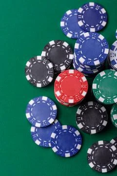 Multicolored casino chips as a conceptual backdrop for gambling games. Mult.. Stock Photos