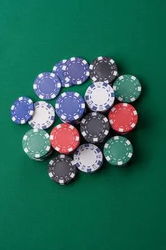 Multicolored casino chips as a conceptual backdrop for gambling games. Mult.. Stock Photos