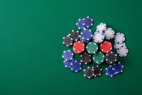 Multicolored casino chips as a conceptual backdrop for gambling games. Mult.. Stock Photos