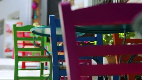 Multicolored chairs out of focus in the cafe. Stock Footage 197376715