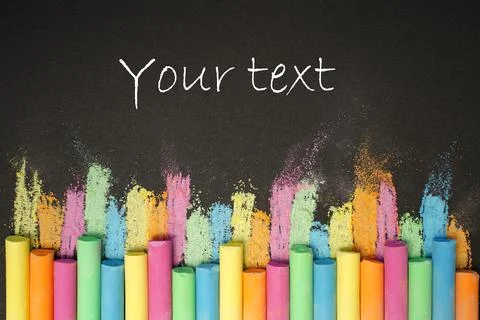 Multicolored chalk in row on black background. Education concept back to scho Stock Photos