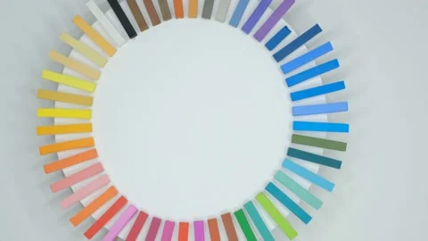 Multicolored chalks rotating on white background Stock Footage 239303152