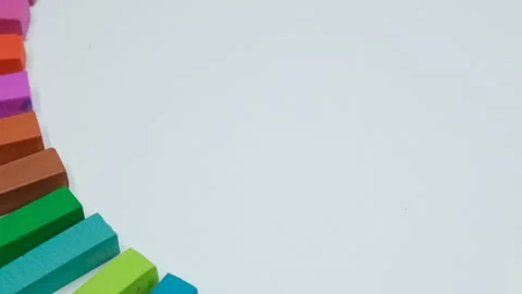 Multicolored chalks rotating on white background Stock Footage 239303161