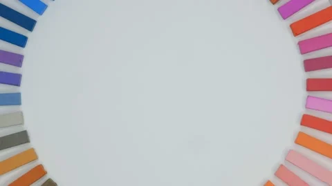 Multicolored chalks rotating on white background Stock Footage 239303162