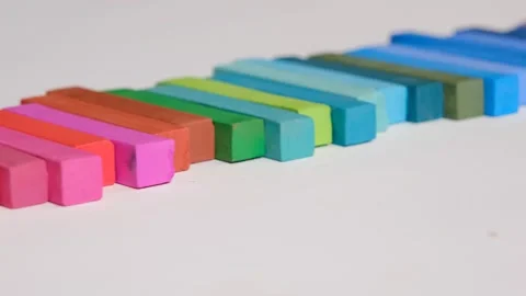 Multicolored chalks on white background Stock Footage 239303136