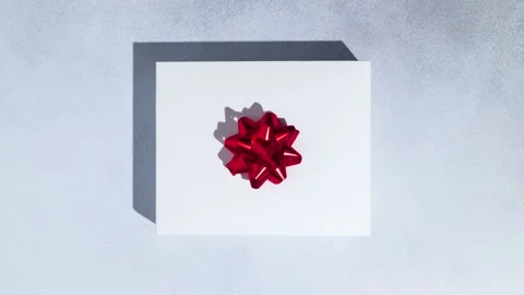 Multicolored Christmas gift boxes changing on grey background. Stock Footage 221790442