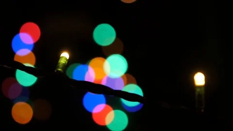 Multicolored Christmas lights in a disco. Multi-colored flashlights flash. Red Stock Footage 73711083