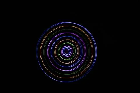 Multicolored circles on a black background Stock Photos