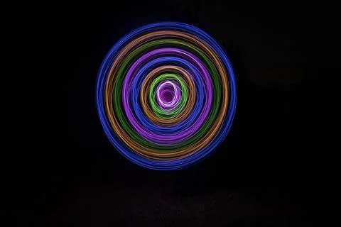 Multicolored circles on a black background Stock Photos