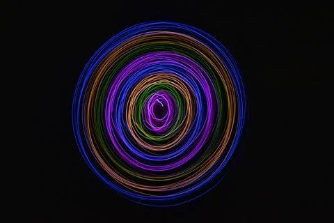 Multicolored circles on a black background Stock Photos