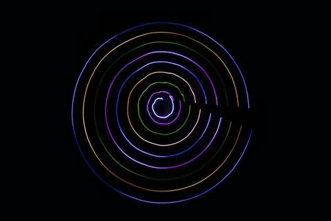 Multicolored circles on a black background Stock Photos