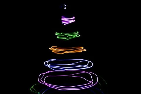 Multicolored circular lights on a black background Stock Photos