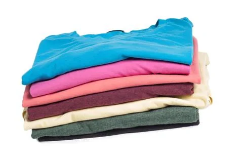 Multicolored clothes in pile Stock Photos