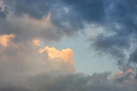 Multicolored clouds at sunset. Sunbeam. 스톡 사진