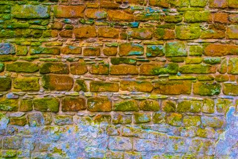 Multicolored cobblestone wall Stock Photos