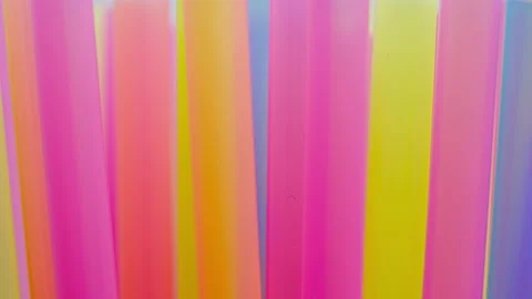 Multicolored cocktail tubes, camera movement, close-up, out focus Stock Footage 140680400