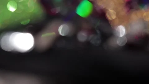 Multicolored colored bokeh lights in the dark Vídeo Stock 318579885