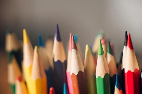 Multicolored colored pencils on a blurred background, children's creativity Stock Photos
