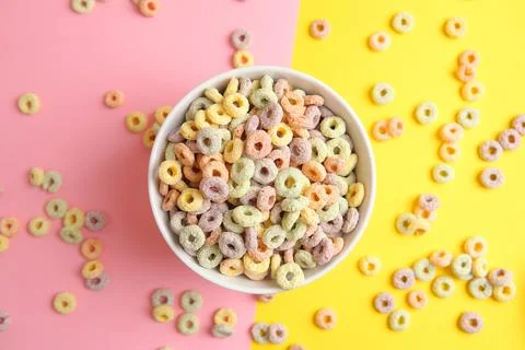 Multicolored corn rings for breakfast on a colored background Stock Photos