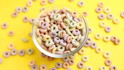 Multicolored corn rings for breakfast on a colored background Stock Photos