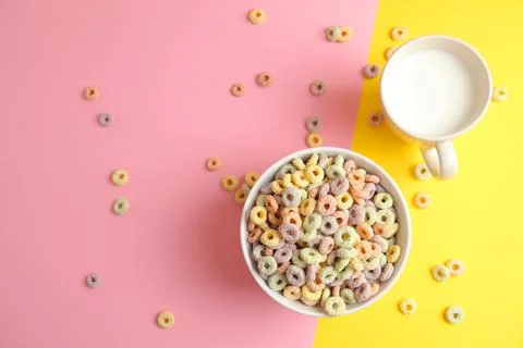 Multicolored corn rings for breakfast on a colored background Stock Photos