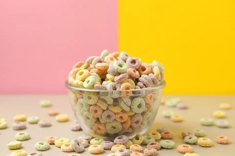 Multicolored corn rings for breakfast on a colored background Stock Photos