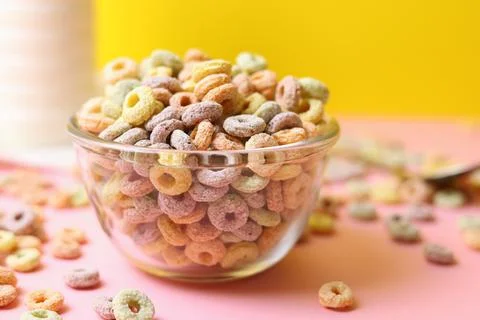 Multicolored corn rings for breakfast on a colored background Stock Photos