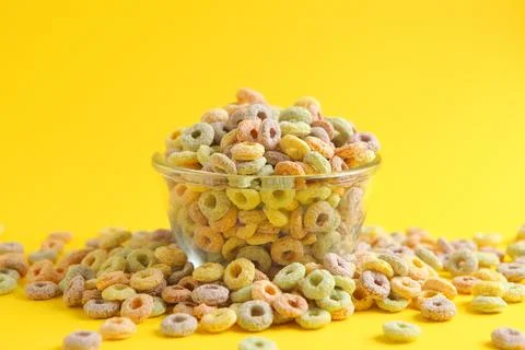 Multicolored corn rings for breakfast on a colored background Stock Photos