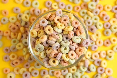 Multicolored corn rings for breakfast on a colored background Stock Photos